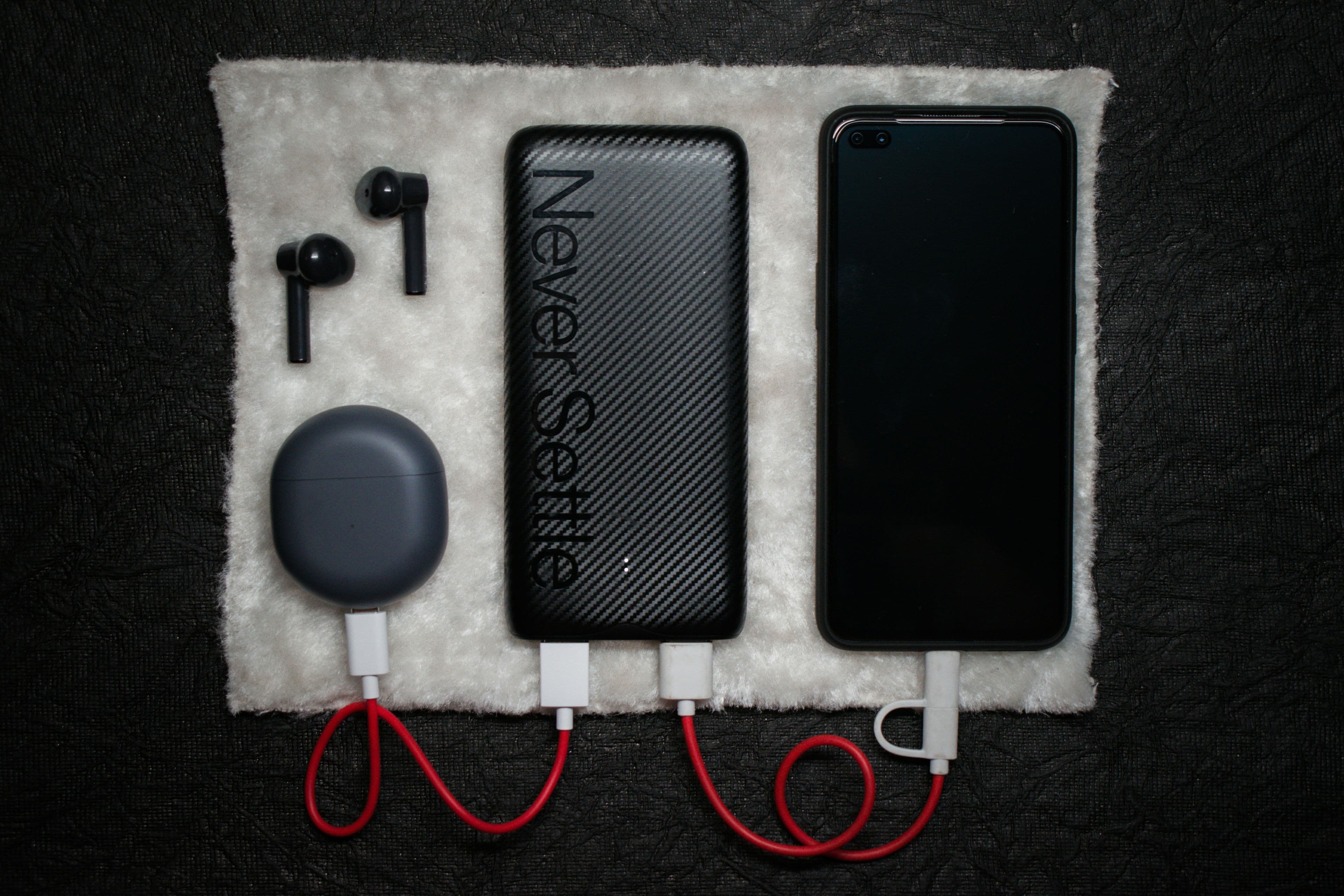 A high-capacity power bank charging a phone and other devices at once